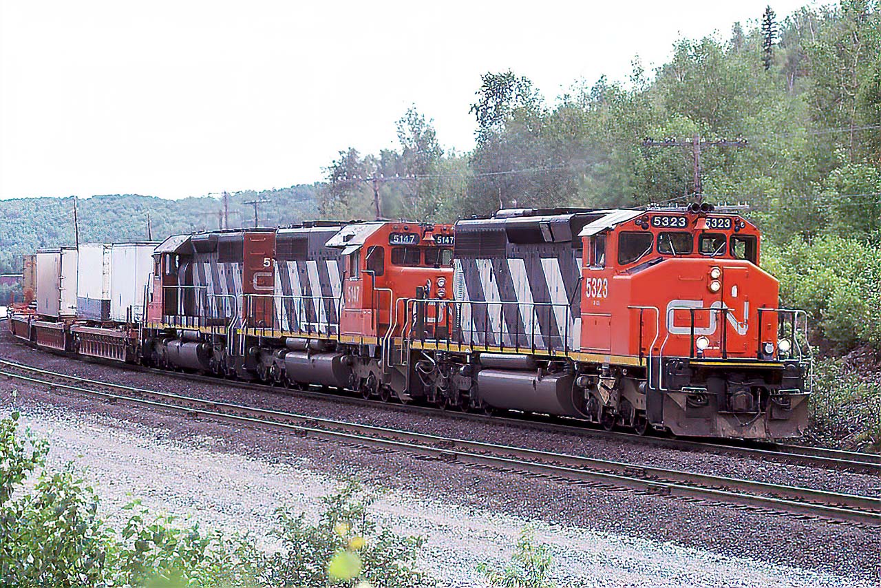 In its time, the hottest train on the railroad, 201 has zipped across through Algonquin Park, Brent, and North Bay beginning its 4 day trek to Vancouver. The early 90's had the best lashups; here an SD40-2W, and 2 SD40's, but the GM and GE cowls were on the property...as were the MLW's running out there last miles. No DPU's, no 12000 foot trains and none..or very little of the over siding length nonsense that paralyses today's operations. It was the best of times....