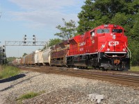 CP 234 with shiny new CP SD70ACu #7053 on the point and Block Heritage unit # 7019 trailing heads eastbound at Guelph Jct. on a bright and sunny morning. I nearly got skunked by counterpart train CP 235 on the close track to get this shot. Talk about a close call!