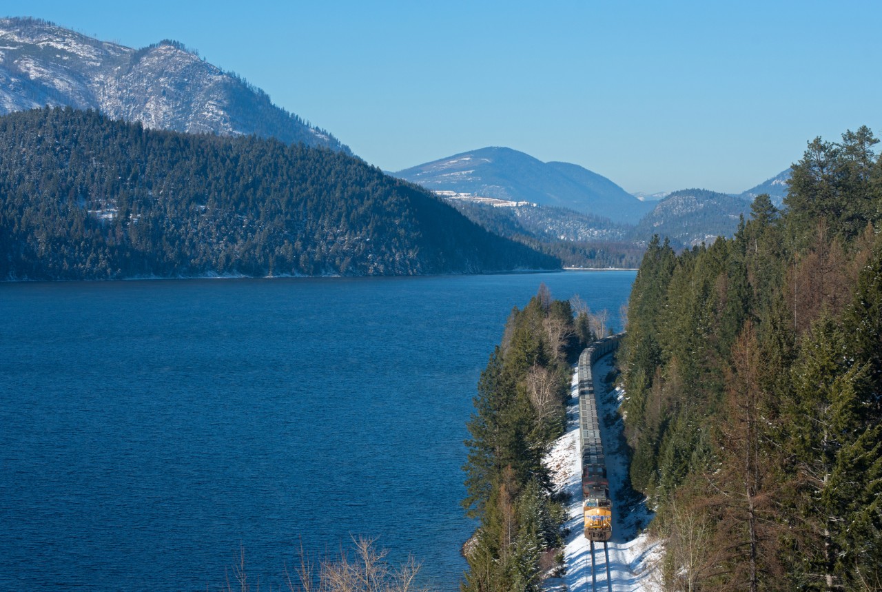 A cool but clear November day sees UP 5535 West hugging the side of Moyie Lake on the west end of CP's Cranbrook Sub.