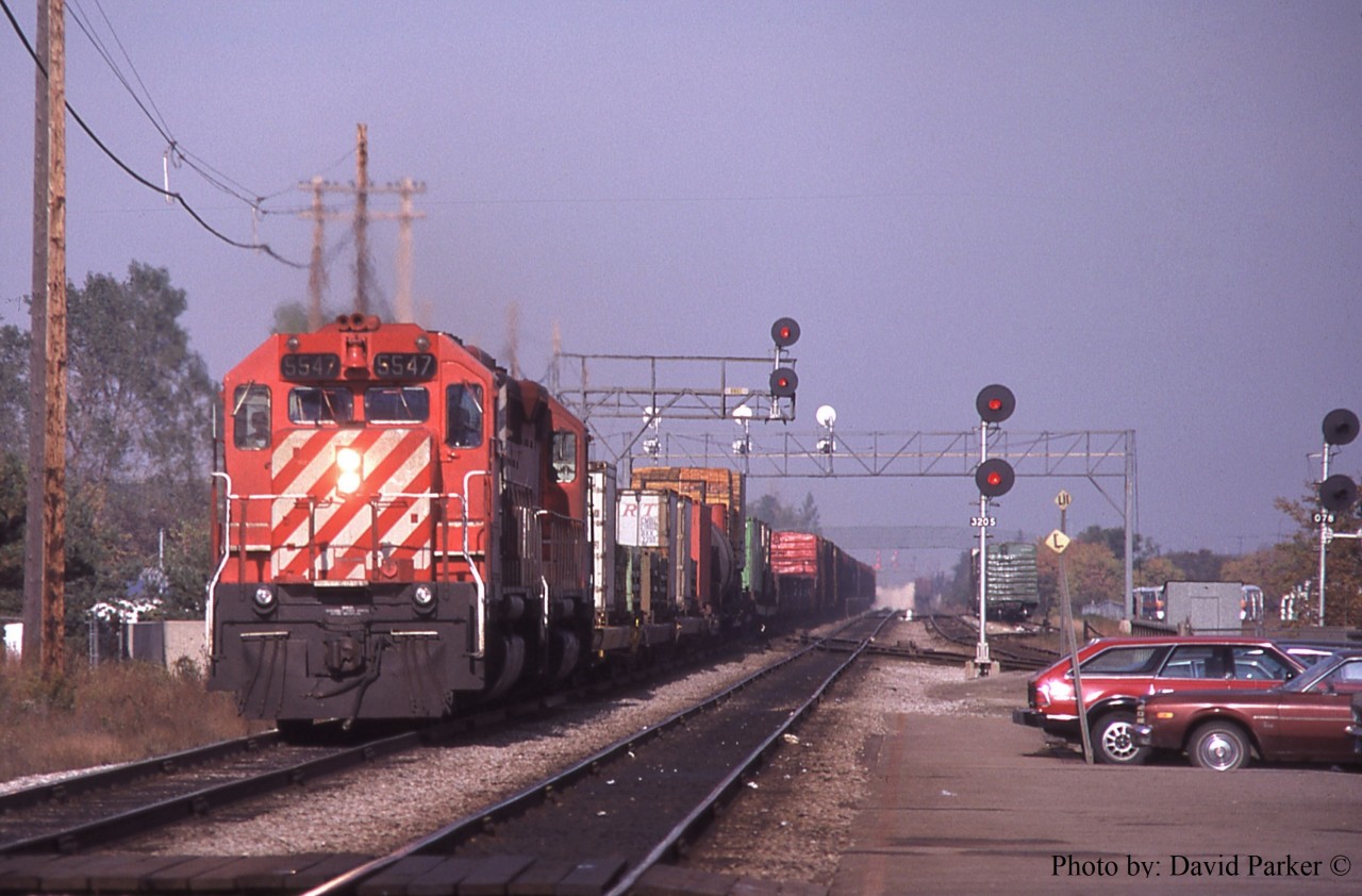The CP Eastbound "Starlite" hustles through Burlington on the CN Oakville Sub behind SD40's 5547 & 5506 on Oct 14th 1981.