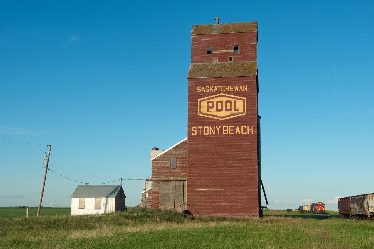 The tiny hamlet of Stony Beach Saskatchewan has one of the best looking elevators still standing today, complete with it's vintage POOL logo.  Stony Beach is also a station name on CN's Central Butte Sub between Regina and Moose Jaw.  In this scene, CN SD60 5418 leads the line's only regular train, the five day per week 556. The train will work the next town, Belle Plaine, for the rest of the evening, then make it to Moose Jaw after dark.