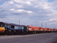  The Goderich & Exeter has just dropped off the latest products from General Motors Diesel in London at CN's MacMillan Yard in Toronto. Fortunately for me, I worked days on Saturdays so took a spin down through the yard after leaving the RTC Centre. 
 Out in the open are Direct Rail Services (UK) JT42CWR 66424
                     SNTF (Algeria) GT36CW's 060DR11-060DR01-060DR12-060DR10 
                 and Direct Rail Services (UK) JT42CWR 66425

July 7th 2007 