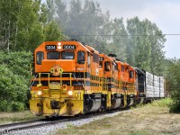 Climbing the hill to St Liboire on the former Grand Trunk mainline train 393 is midway through its journey from Richmond, QC to CN's Southwark yard near Montreal.  The four units are working hard with 84 cars in tow.