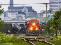 On June 20, train 406 derailed 8 cars while entering Island Yard in Saint John. The following morning, they're finally leaving town, see here in the east end of the city, passing by the derailment site. 