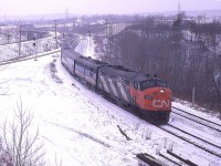 Oh, what the heck. As today July 9th might be the hottest day of the year so far; good time to post a winter photo. This was taken not long before Christmas, way back in 1978; and CN 6519, 6870 lead a decent noon hour train eastward to Toronto.  And yes; given a choice, I prefer winter over the dog days of summer.