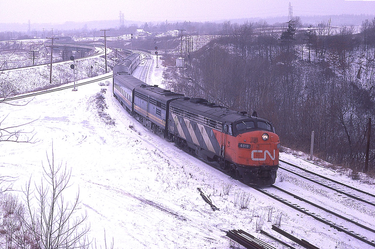 Oh, what the heck. As today July 9th might be the hottest day of the year so far; good time to post a winter photo. This was taken not long before Christmas, way back in 1978; and CN 6519, 6870 lead a decent noon hour train eastward to Toronto.  And yes; given a choice, I prefer winter over the dog days of summer.