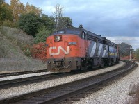 CN 6770 leads westbound #75 thru the junction on a rather cool fall afternoon. As for the other power on this train, alas, I was unable to locate my notes. Unit retired by 1989 and not preserved like many in this series were.