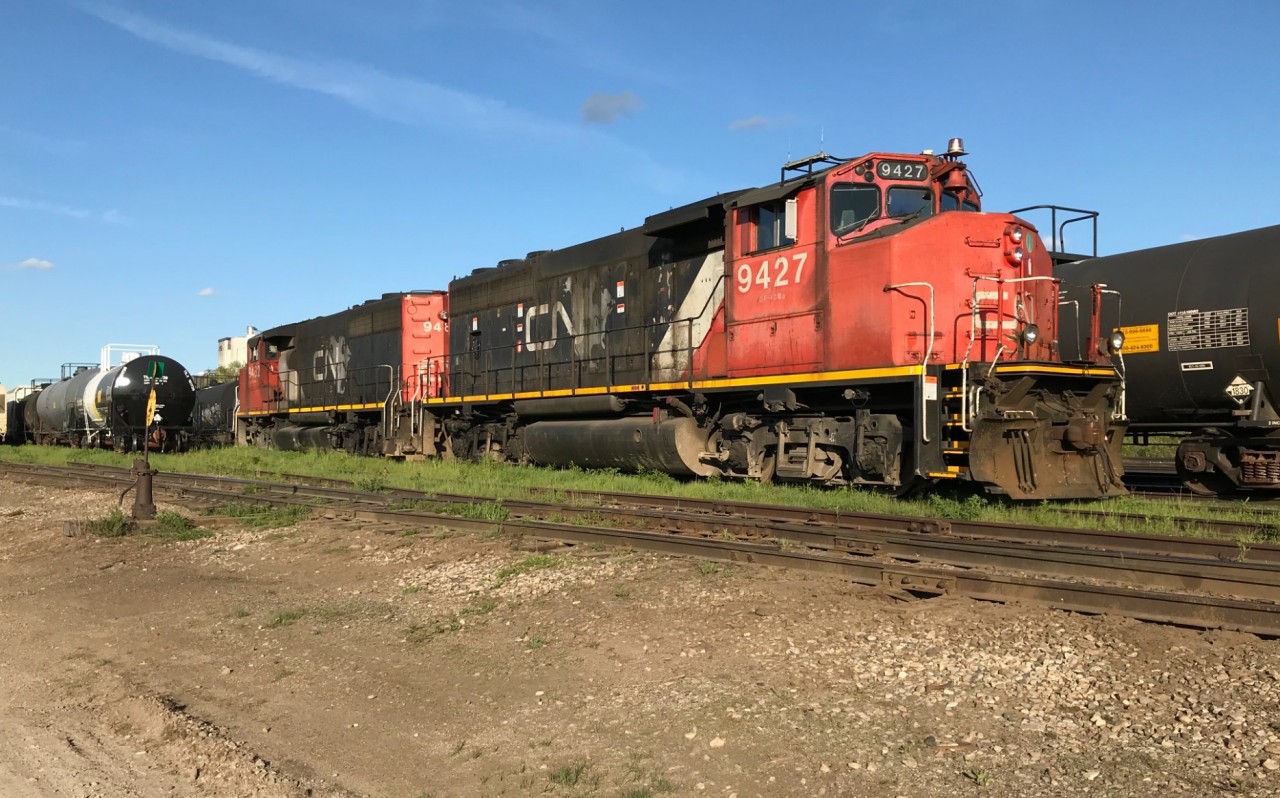 CN had unveiled its 'CN North America' paint scheme in mid-1992, which was designed to promote the company’s expansive Canada to Mexico transportation network with their BN-FNM partnership into Mexico at the time. While the classic noodle logo remained, it was placed on a grey map designed to replicate North America. The first units to receive the paint scheme were CN’s newly rebuilt SD40u’s in the 6000 series, as well as 25 new Dash 8-40CM 2400's that were delivered new in the livery from GE in November-December 1992. Then in 1994-1995, CN’s new Dash 9-44CW’s 2500-2522 had also arrived with the CNNA map scheme. As well hundreds of other CN units were repainted into the colours including; GP40-2L(W)’s, SD40’s, SD40-2(W)’s, while four-axle units received a slightly modified version when they were repainted minus the grey map. However, a year later in 1995, when CN’s new SD70I’s were released from GMDD in London they had a modified scheme with a just a large CN noodle on the long-hood that no longer featured the CNNA map. (Reference to Eric Gagnon- Trackside Treasure Blog for information)

Here CN 9427 and 9482 are seen on a sunny evening awaiting a return trip back to Toronto at the Kitchener, Ontario yard. The pair are both still adorned in their CNNA schemes, some 27 years after its debut. The units had arrived overnight on A431 after once again stalling on the big grade near Acton on the Guelph Subdivision. This had resulted in them laying over in Kitchener as there was no time for the crew to return to MacMillan yard that night.
