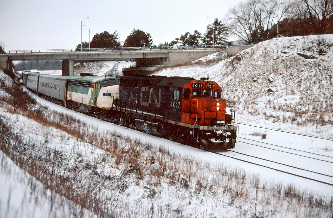 As this is posted, we are in the midst of a heat wave in southern Ontario...so let's try to "cool things off" with a "cool shot" from January 1977. This morning's train from Windsor has an interesting consist--CN GP40 4017 (geared for passenger service), borrowed GO Transit APCU (auxiliary power control unit) 901, and Tempo coaches! Renumbered to 9317, the GP40 was used in VIA passenger service into the mid-1980s, the ACPU units--many rebuilt from Ontario Northland FP7s--were in GO service into the mid-1990s, and most of the Tempo cars were retired by VIA and sold in 1987 (a few hung on into 1990).
