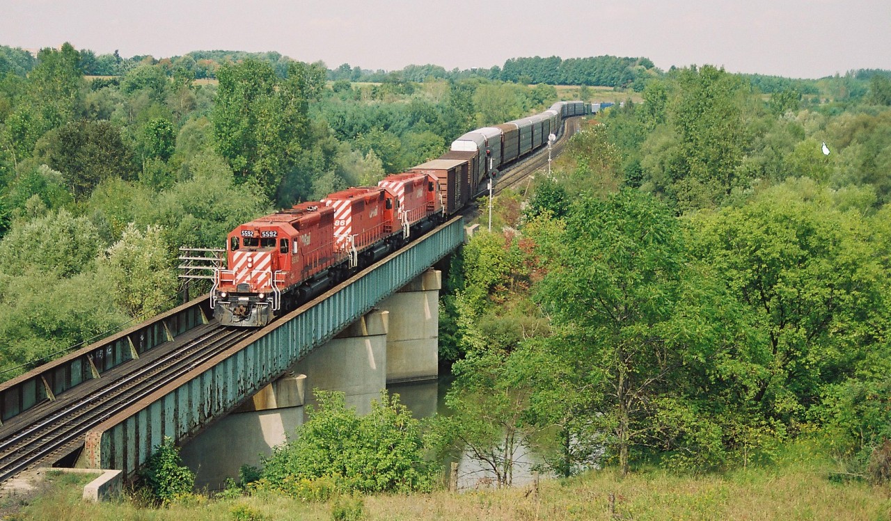 CP 5592 departs Coakley siding on the Galt Subdivision with sister SD40-2's 5686 and 5659 after meeting 5565 east. During the St. Lawrence & Hudson (STLH) era in Ontario, most of CP's mainline trains were powered by mainly SD40's and SD40-2's with aging four-axle MLW's scattered throughout as well.