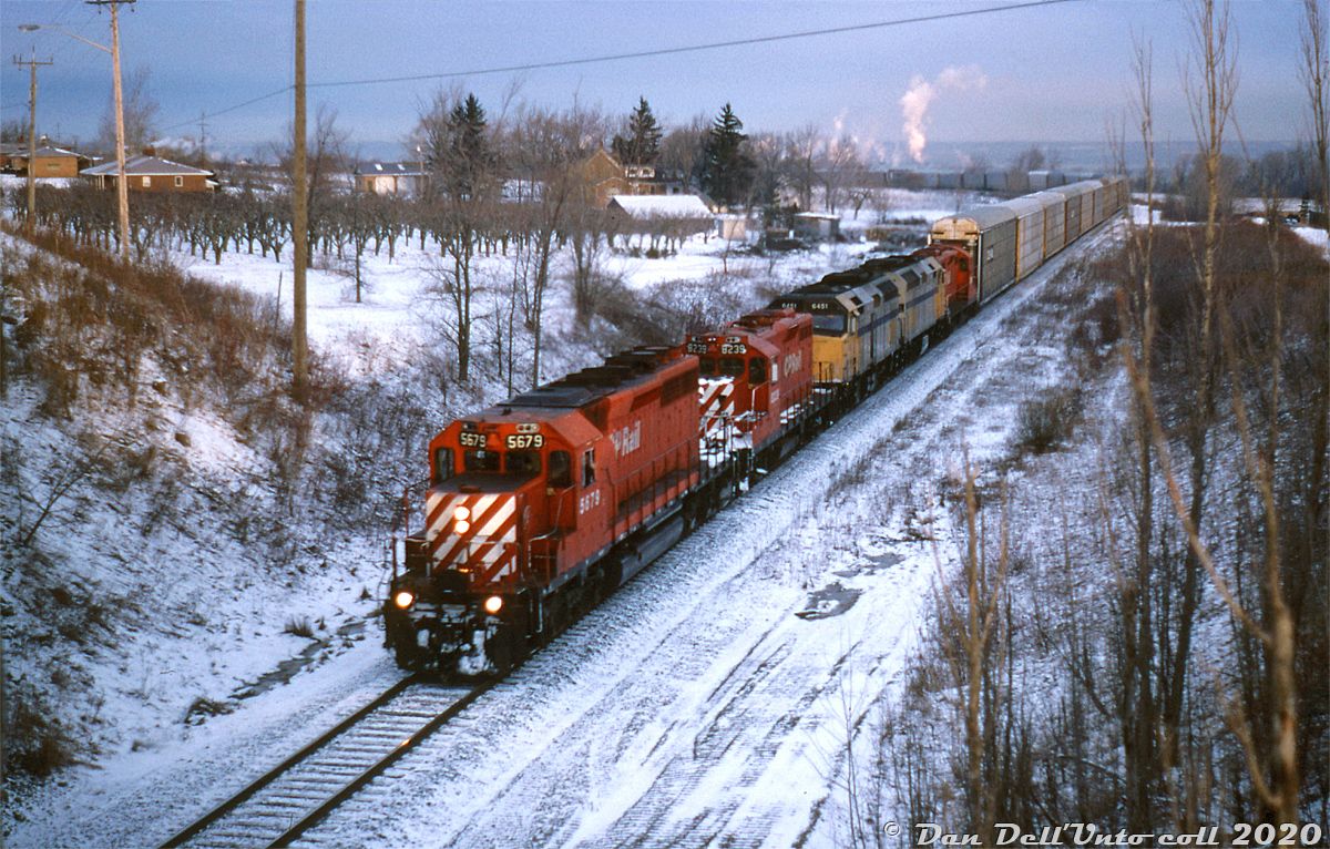 VIA units pulling freight on the old TH&B: During CP's lease-anything-that-runs era in the 90's, Reg Button was out on a cold February morning in 1995 to catch a rather odd lashup: CP SD40-2 5679 leading GP9u's 8239 and 8236, that are bracketing a pair of leased VIA F40PH-2 passenger units (VIA 6451 & 6449). They're seen at the head-end of CP train #526, cresting the climb up the Niagara Escarpment on CP's Hamilton Sub at Vinemount.

At one point amid all the rent-a-wrecks and lease units CP had running around the system, they had eight surplus VIA F40's running around in freight service, working all sorts of locals, turns, wayfreights and mainline trains with CP power (mostly in the Toronto/southern Ontario area, and the Windsor-Toronto-Montreal corridor).

Reg Button photo, Dan Dell'Unto collection slide.