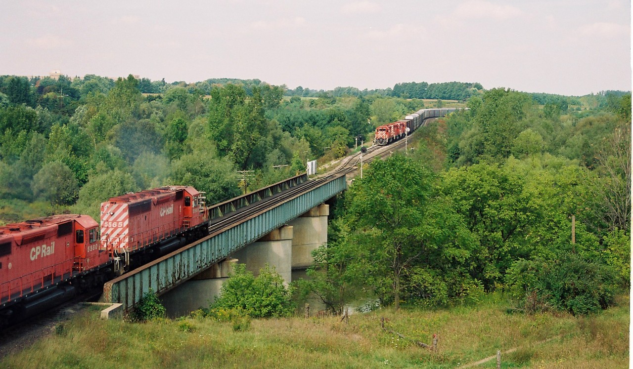 An eastbound with 5565, which was CP's first SD40-2, is about to meet a westbound at the west siding switch Coakley as it heads to Toronto on the Galt Subdivision.