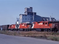 A trio of nearly new GP38ACs lead a train out of Calgary in August 1971. The 3020 is only about six months old at the time of this photo; the other units (3013 and 3012) would only be a few months older.