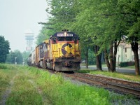 I was surprised to see this train while down in the Falls snooping around because it usually ran much later than the approximate Noon I shot this.
CSX 2002, 7897 heading stateside, having just cleared Clifton Hill and now parallel to Palmer Ave by Mile 1. Interesting to note for todays photographers a sign for Kodak Film on that tower in the old Maple Leaf Village. Yep, we loved it back then.