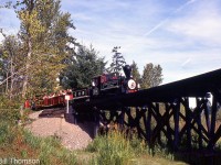 Another view of Cowichan Valley Railway 0-4-0ST <a href=http://www.railpictures.ca/?attachment_id=41936><b>steam engine 24</b></a>, this time pulling a car full of visitors over a trestle, on trackage inside the British Columbia Forest Museum Park.