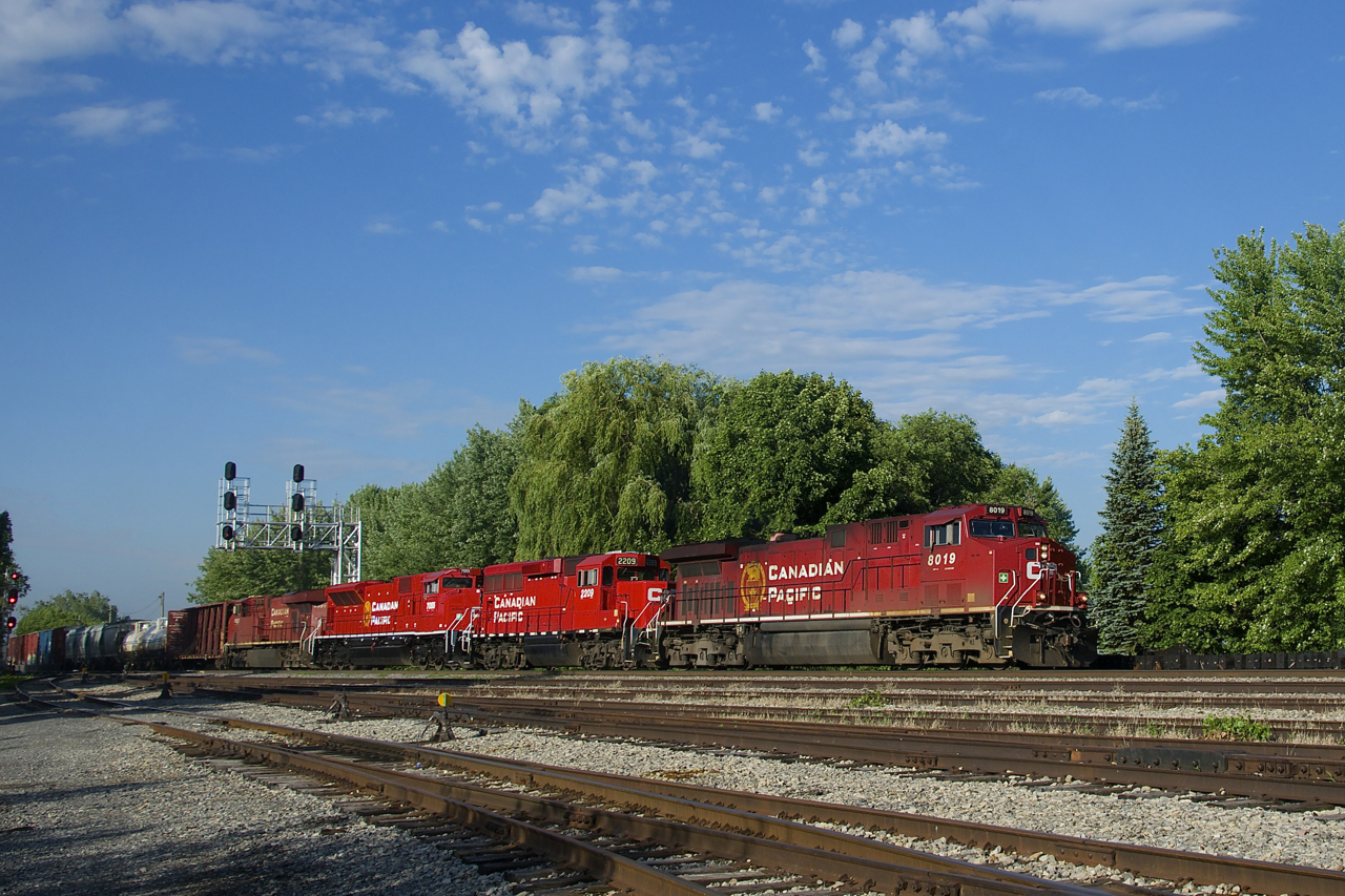CP 253 has a diverse lashup as it passes Lasalle Yard with AC4400CWM CP 8019, GP20C-ECO CP 2209, SD70ACU CP 7055 and ES44AC CP 8821.