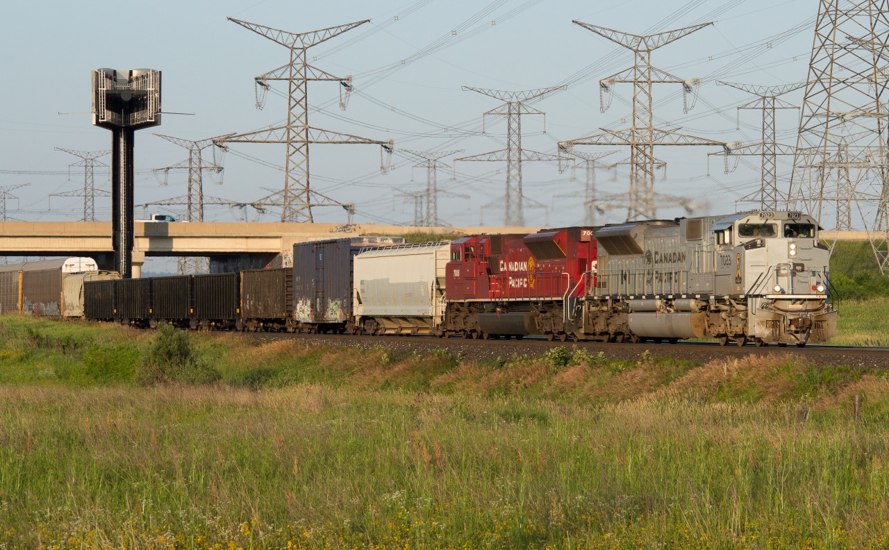 Early bird gets the worm, in todays case, CP 7023 leading 235 was the worm.  The time is 6:40 and the sun is just up high enough to illuminate the scene at Ninth Line as the train barrels towards its destination of Toronto Yard.  Having tried for 7023 leading on Wednesday and not being successful, this redemption was nice.