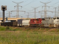 Early bird gets the worm, in todays case, CP 7023 leading 234 was the worm.  The time is 6:40 and the sun is just up high enough to illuminate the scene at Ninth Line as the train barrels towards its destination of Toronto Yard.  Having tried for 7023 leading on Wednesday and not being successful, this redemption was nice.