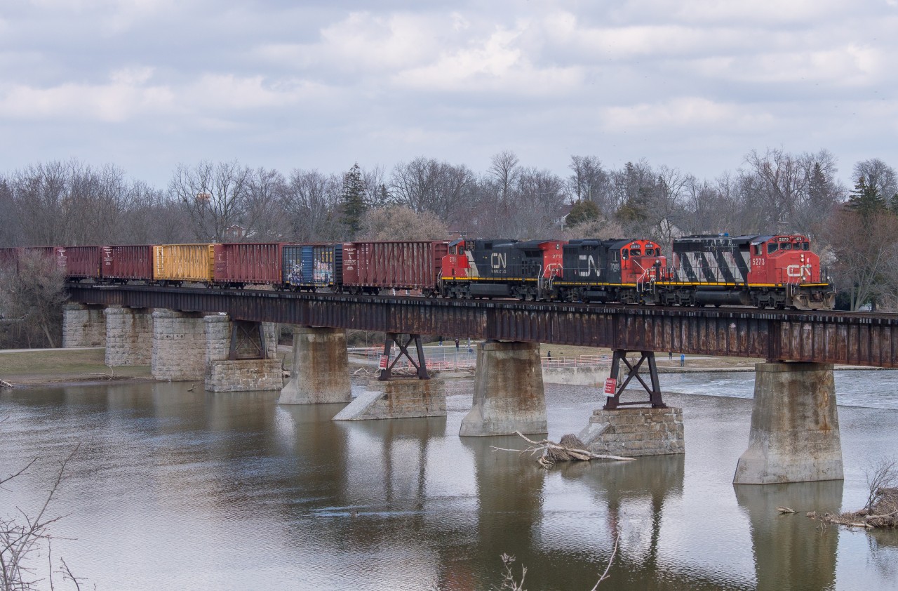 CN L580 trundles across the Grand River in Caledonia with CN 5273, CN 7046 and IC 2710.  This consist only made it down to Caledonia in daylight one time.  In March there was a short period of time where Brantford had 2 sets of power, GMTX 2277 and GMTX 2695 along with the above consist.  580 commonly used the pair of GMTX during the day and the 5273 set would go out on 581 at night.  On this day there were two 580's running, one to work around Brantford and this one with cars for CGC in Hagersville.