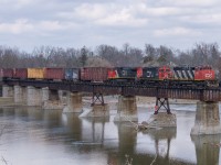 CN L580 trundles across the Grand River in Caledonia with CN 5273, CN 7046 and IC 2710.  This consist only made it down to Caledonia in daylight one time.  In March there was a short period of time where Brantford had 2 sets of power, GMTX 2277 and GMTX 2695 along with the above consist.  580 commonly used the pair of GMTX during the day and the 5273 set would go out on 581 at night.  On this day there were two 580's running, one to work around Brantford and this one with cars for CGC in Hagersville.  