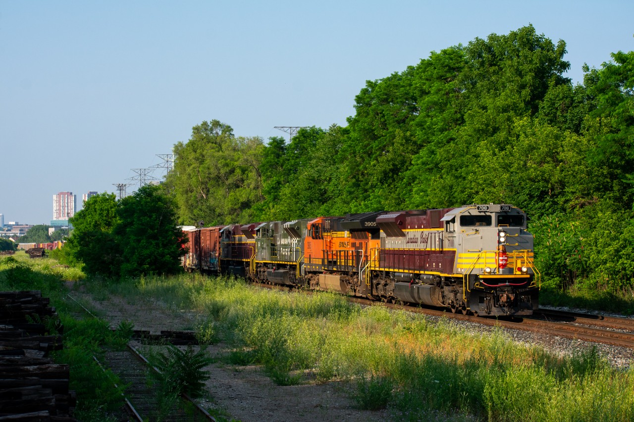 If you had told me a year ago that I'd see CP 421 with 3 CP engines and not a single one painted in red I would've said you're out of your mind. Sure enough, yesterday's 421 consisted of 2 ACu's in the maroon/grey scheme, CP's D-Day ACu 6644, and a BNSF ET44AC(?) thrown in for good measure. Quite a catch for sure, and I'm glad this train came about 3 hours later than usual as the sweet evening light was just beginning to set in when it passed me at Leaside. I hope you enjoy the shot!