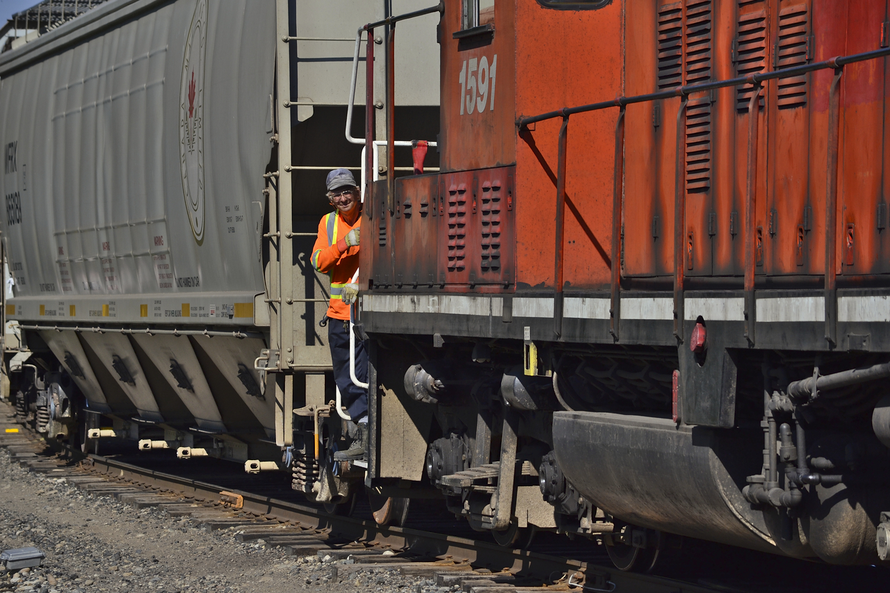 I always try to avoid having people or obstructions in my photos, ( birds seem to always work their way in somehow though ) After a chat with this conductor whos name escapes me, continues on moving cars for T69 to lift later on. I couldn't say no to this photo though, that smile just makes this worth while.