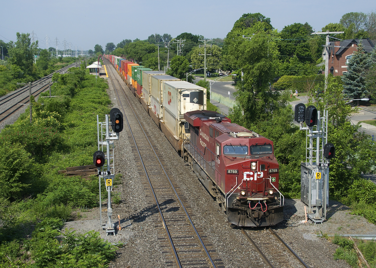 CP 112 splits the signals just east of Cedar Park Station with a nearly 600-axle long train.