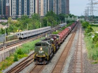 Very similar to this shot <a href="http://www.railpictures.ca/?attachment_id=41931"> http://www.railpictures.ca/?attachment_id=41931</a>  by my friend Jacob Estrin, another CP 246 is racing a TTC T1 subway through Kipling / Obico. This 246 was lead by the D-Day commemorative unit 6644, as well as a heritage unit trailing!