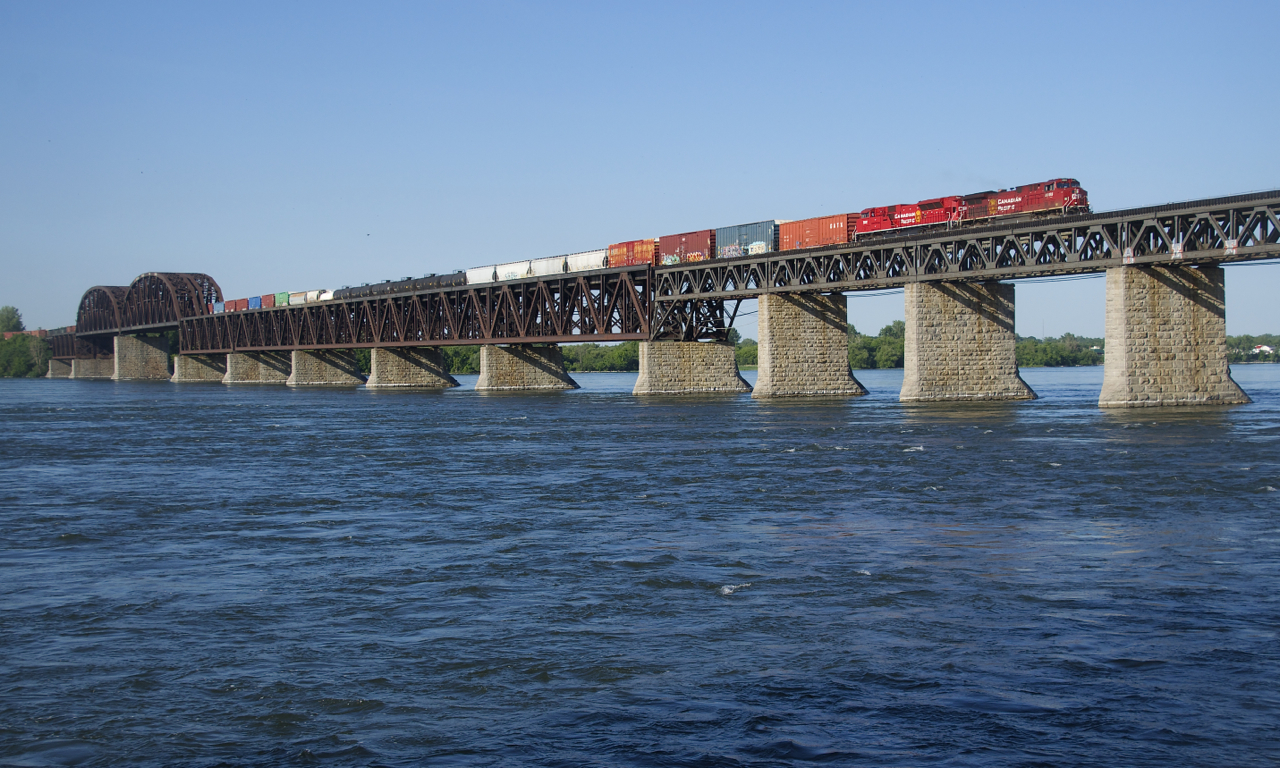 Rebuilds CP 8055 & CP 7031 lead CP 253 over the St. Lawrence River on the west track of CP's Adirondack Sub.