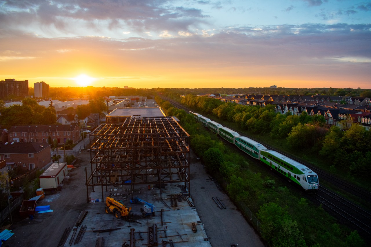 The first Lakeshore East GO train of the morning glides into Danforth while the sun begins to crest over the horizon. My balcony was the perfect spot to capture this moment from an elevation!