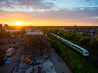 The first Lakeshore East GO train of the morning glides into Danforth while the sun begins to crest over the horizon. My balcony was the perfect spot to capture this moment from an elevation!