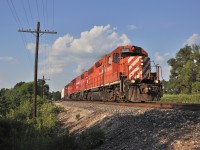 T69 screams East after making a large lift in Guelph Junction with roughly 25/30 hoppers in tow.