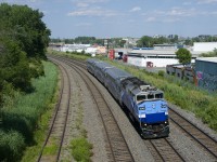 EXO has reduced both train sizes and train frequency since June 22nd. Here EXO 1207 heads west with AMT 1348 and only three cars. Until recently this train had been running with eight cars.