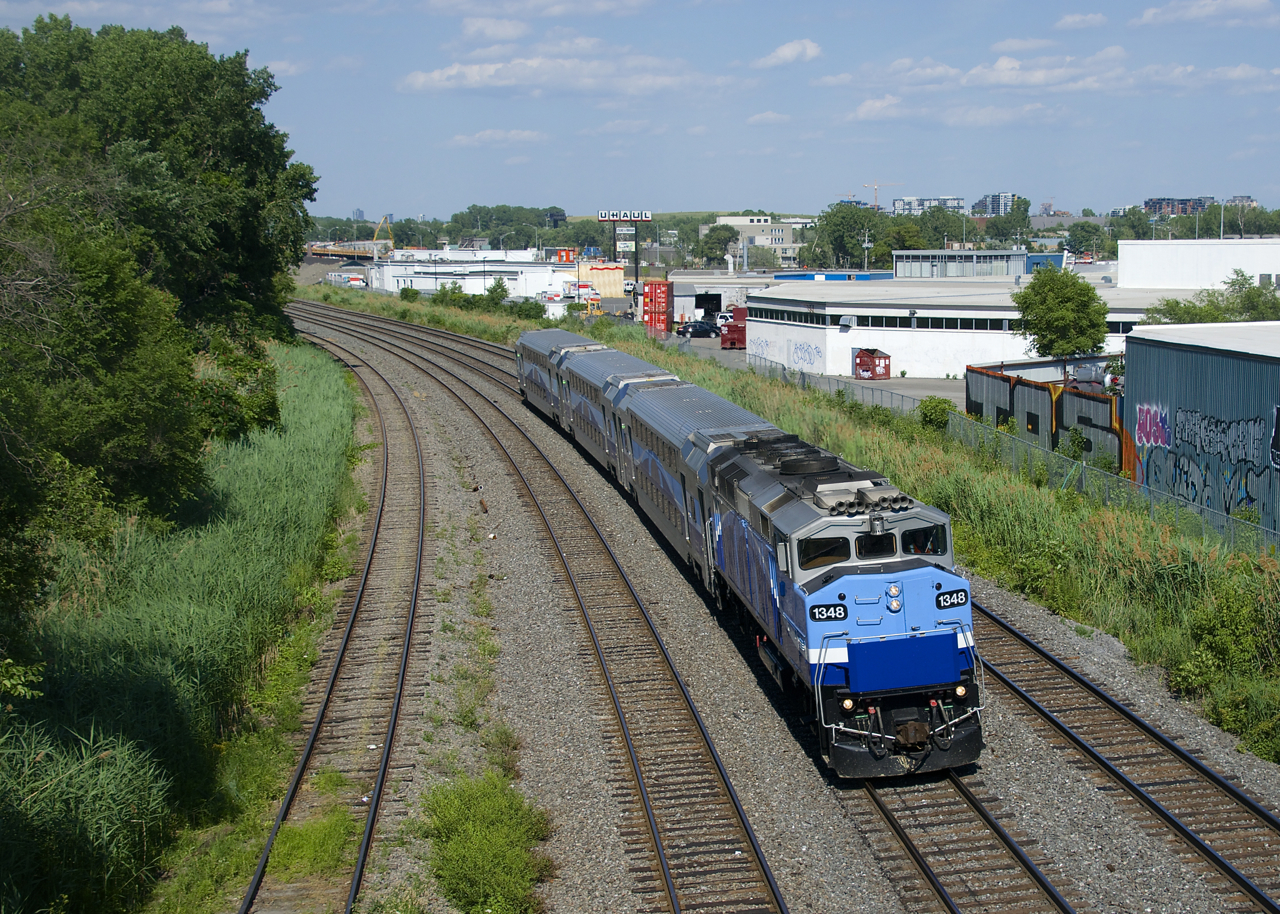 EXO has reduced both train sizes and train frequency since June 22nd. Here EXO 1207 heads west with AMT 1348 and only three cars. Until recently this train had been running with eight cars.
