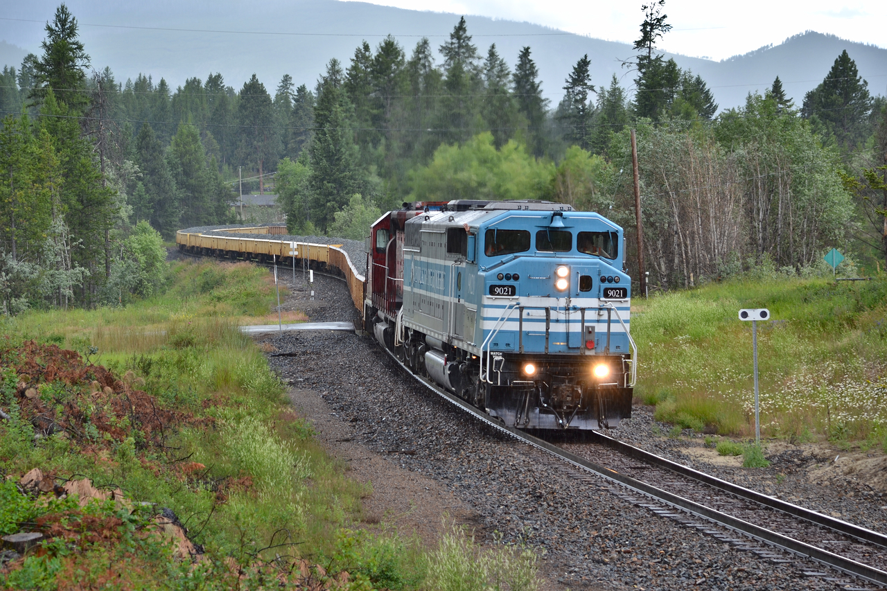 CMQ 9021 is back on the open road after being in Aylth receiving repairs the last couple of weeks. I didnt think I would end up catching it on its first trip since being released. Here 9021 and 5743 drag their ballast train towards Ft Steele BC, the rain added for a bit of a wet touch.