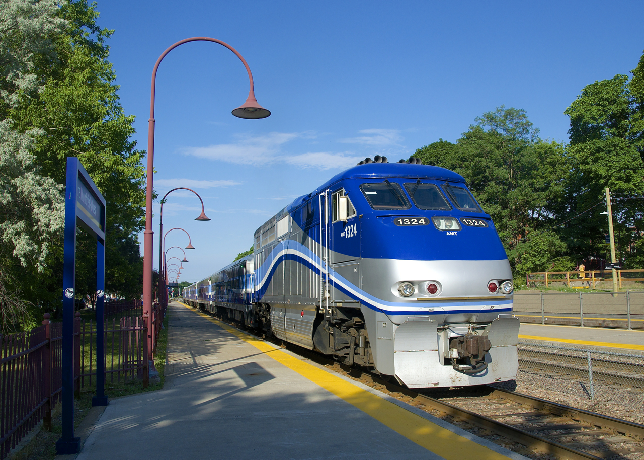 EXO 76 from Candiac is departing Montreal West Station during the morning rush hour.