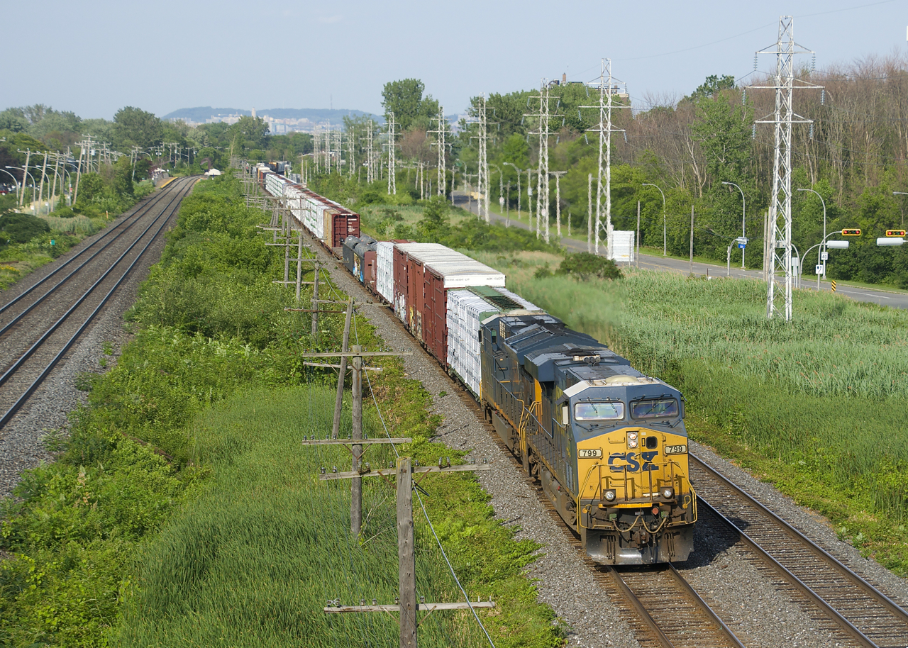 A long CN 327 (140 cars) is approaching MP 14 of CN's Kingston Sub with the usual CSX power (CSXT 799 & CSXT 3394).