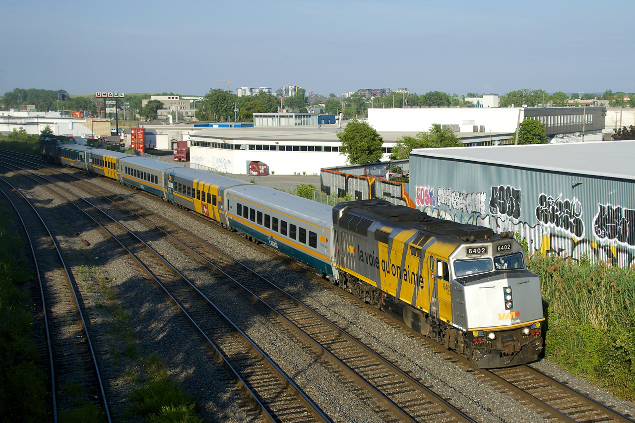 The second and last VIA Rail departure of the day from Montreal to Toronto (VIA 669) heads west with VIA 6402 up front and VIA 6419 bringing up the rear.