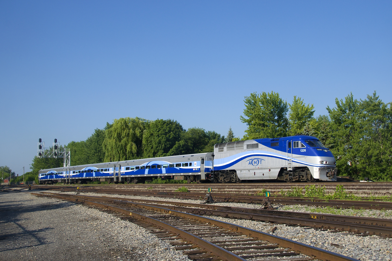 EXO 76 has AMT 1326 and only three cars as it passes Lasalle Yard.