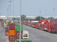 CP 112 is passing stacked containers as it slowly enters Lachine IMS Yard.