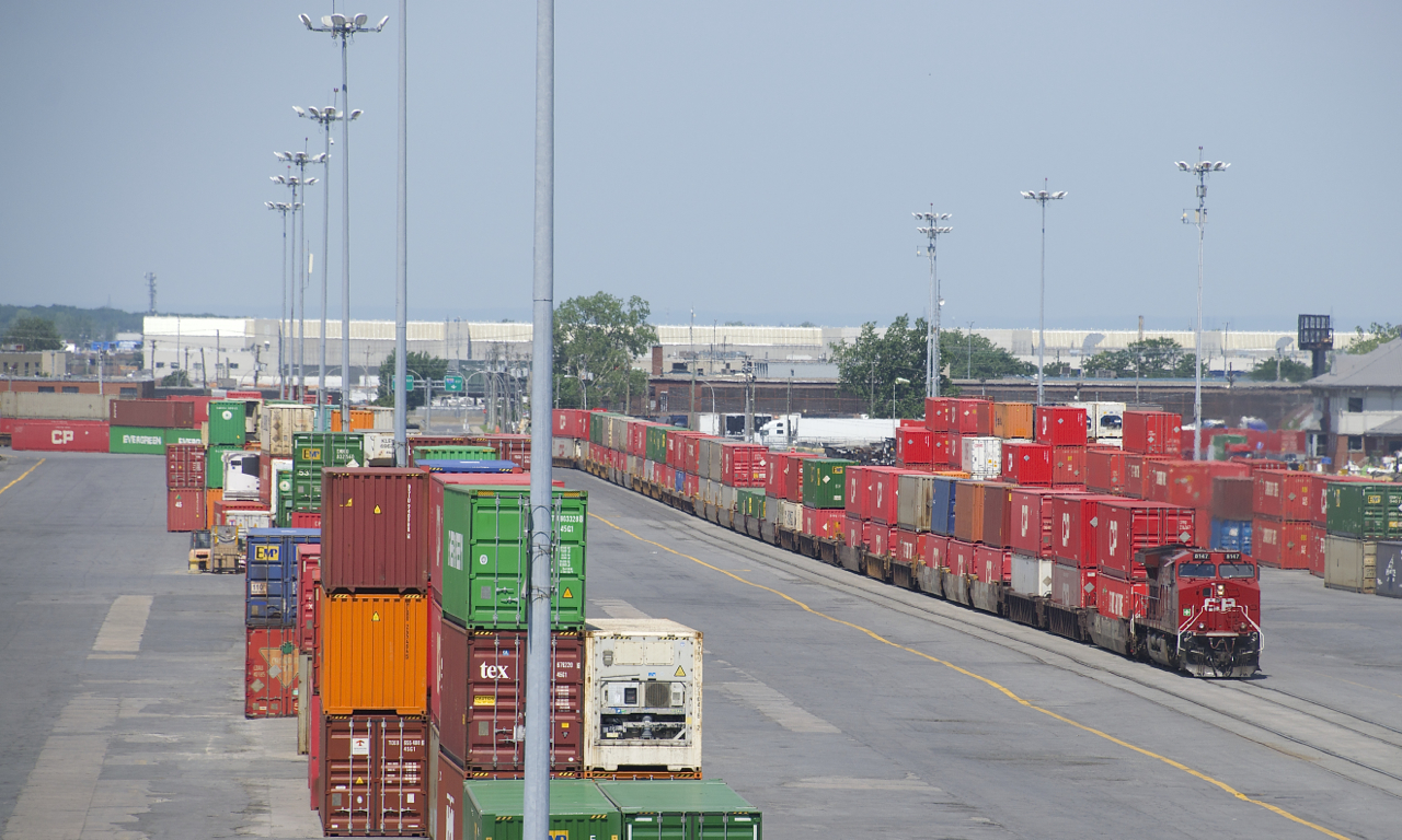 CP 112 is passing stacked containers as it slowly enters Lachine IMS Yard.