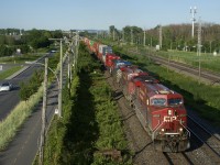 CP 119 has CP 8727, CP 8873, CEFX 1044 (dead in transit) and spotless CP 7054 as it heads west on a sunny evening. 