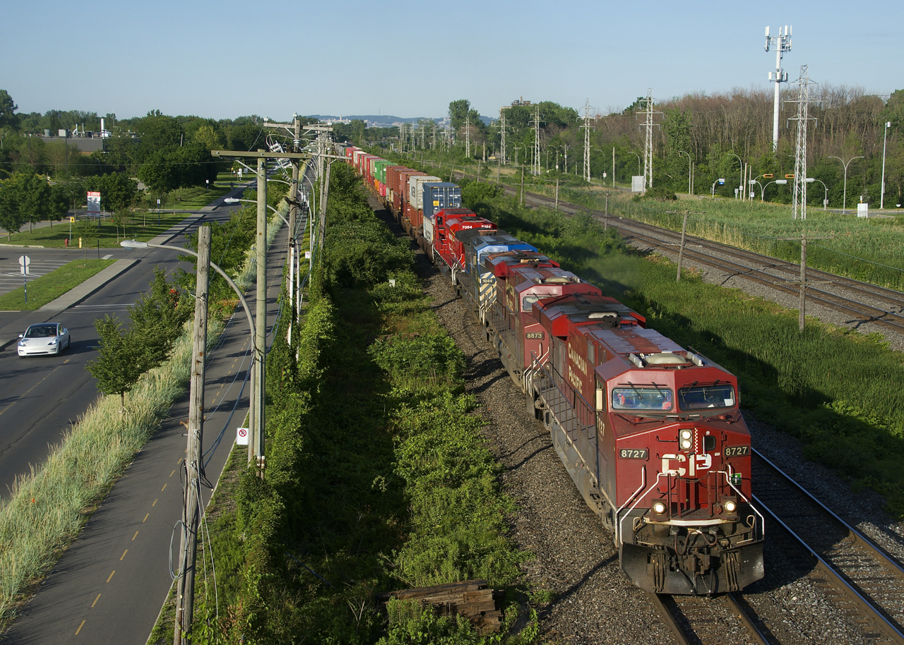 CP 119 has CP 8727, CP 8873, CEFX 1044 (dead in transit) and spotless CP 7054 as it heads west on a sunny evening.