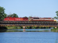 Considering how long I stood on the bank of the Welland River watching the carp, I figured I would post this photo for the world to see.  Good old CP; hurry up and wait.  They worked Aberdeen, worked Kinnear, met 247 somewhere in Hamilton and may have been delayed by them, and had 25 mph slow orders from about MP 34 to Welland.  The train finally showed up about 2 hours later then I anticipated.  I've got to stop being so optimistic about estimating times.  CP 7010 and CP 8102 just fit between the trees on the Welland River bridge.  Notice how much longer the SD70ACu is compared to the GE.  CP 255 was done their work and waiting in Welland Yard for 246 to clear the north siding switch.