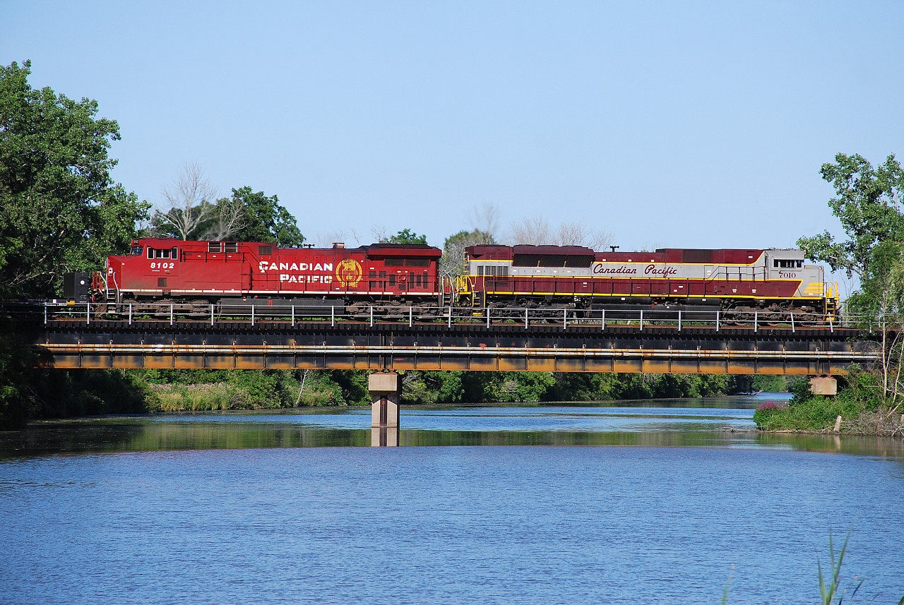 Considering how long I stood on the bank of the Welland River watching the carp, I figured I would post this photo for the world to see.  Good old CP; hurry up and wait.  They worked Aberdeen, worked Kinnear, met 247 somewhere in Hamilton and may have been delayed by them, and had 25 mph slow orders from about MP 34 to Welland.  The train finally showed up about 2 hours later then I anticipated.  I've got to stop being so optimistic about estimating times.  CP 7010 and CP 8102 just fit between the trees on the Welland River bridge.  Notice how much longer the SD70ACu is compared to the GE.  CP 255 was done their work and waiting in Welland Yard for 246 to clear the north siding switch.