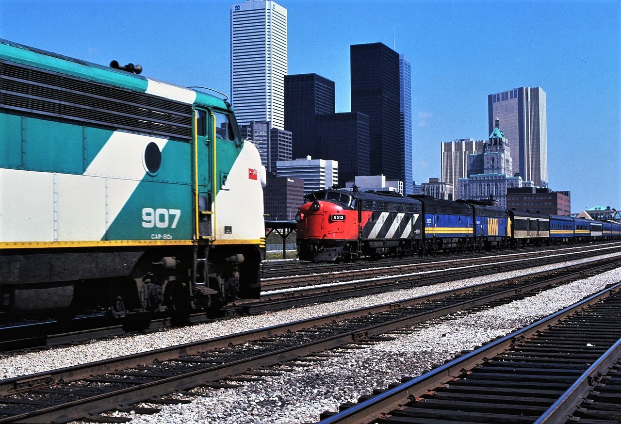 On Sunday September 9 1979, VIA's Super Continental, Train 5 (I think??), heads out of Union Station, Toronto, Ontario and is almost blocked by an inbound GO Transit train.  The power for the Super Continental is 6513 6623 6504.