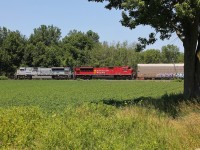 CP 235 passes through the Chatham-Kent countryside with one of CP's military ACus on the point. 