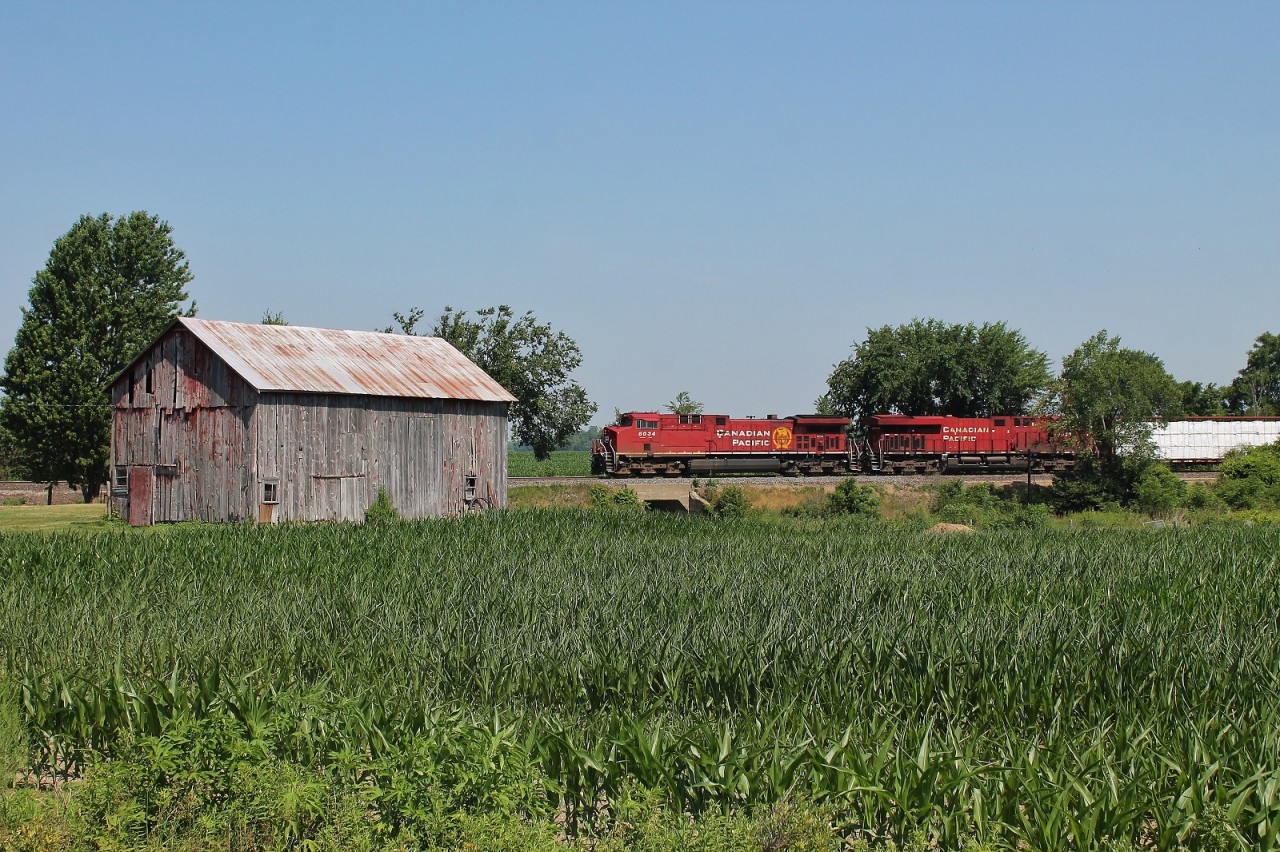 CP 235 passes a barn next to Haggerty Creek as they head west towards Windsor. To my knowledge there used to be a station at the nearby crossing, but a quick Google search only turns up photos of the old GTR/CNR station in the town of Newbury on the Chatham Sub (also long gone). Anyone have any photos of the CP station here?