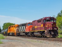 Thunder Bay's CN Yard power has quite the eclectic lashup - with DMIR 403, CN 5350, and EJE 672. They're pictured here  with cars in tow for McAsphalt.