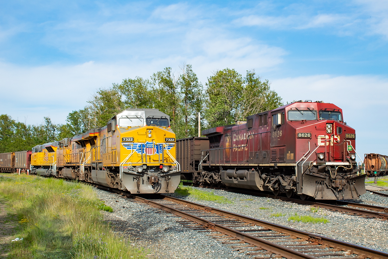 The power for what would become CP 851 (CP 8626) rests next to what would become CN U702 (UP 7322) on McKellar Island in Thunder Bay. Both trains have recently been unloaded at Thunder Bay Terminals, with CP 850 having brought in coal loads, and CN U701 having brought in coke loads.